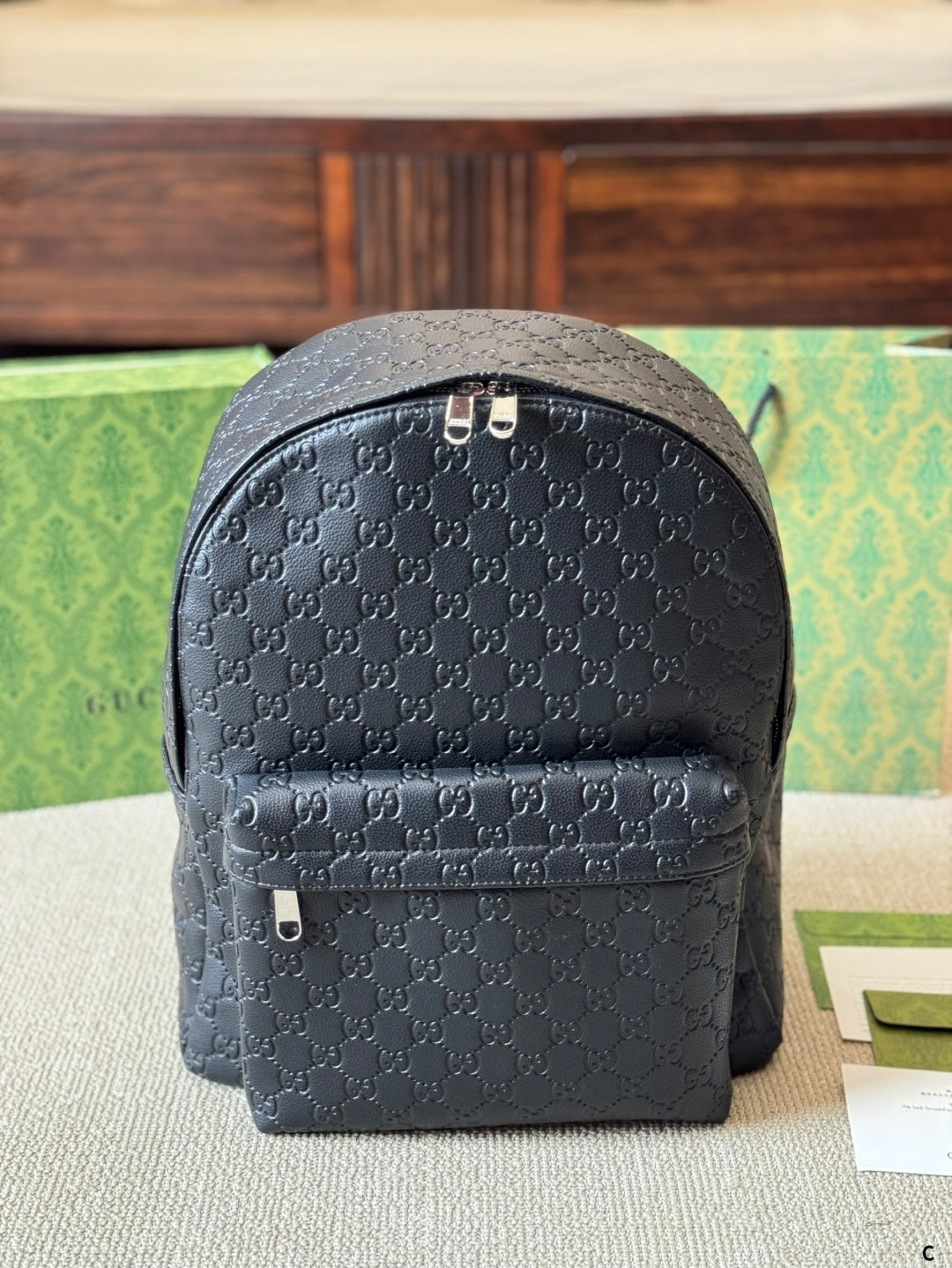 GUI Embossed leather backpack 1825052304