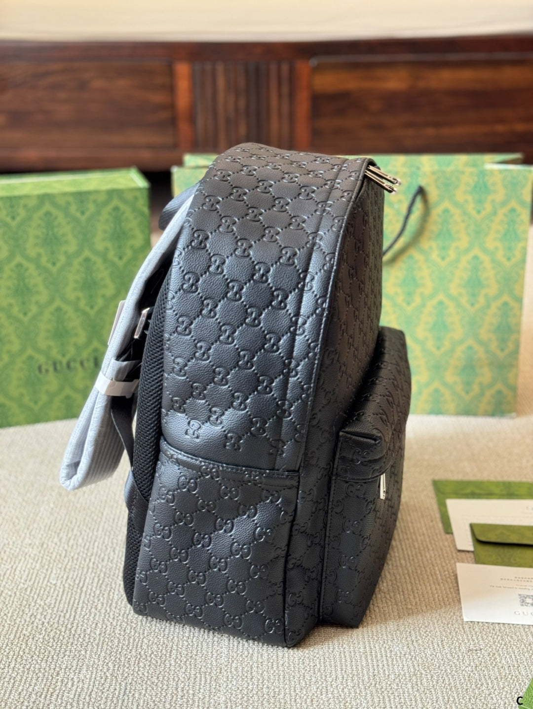 GUI Embossed leather backpack 1825052304